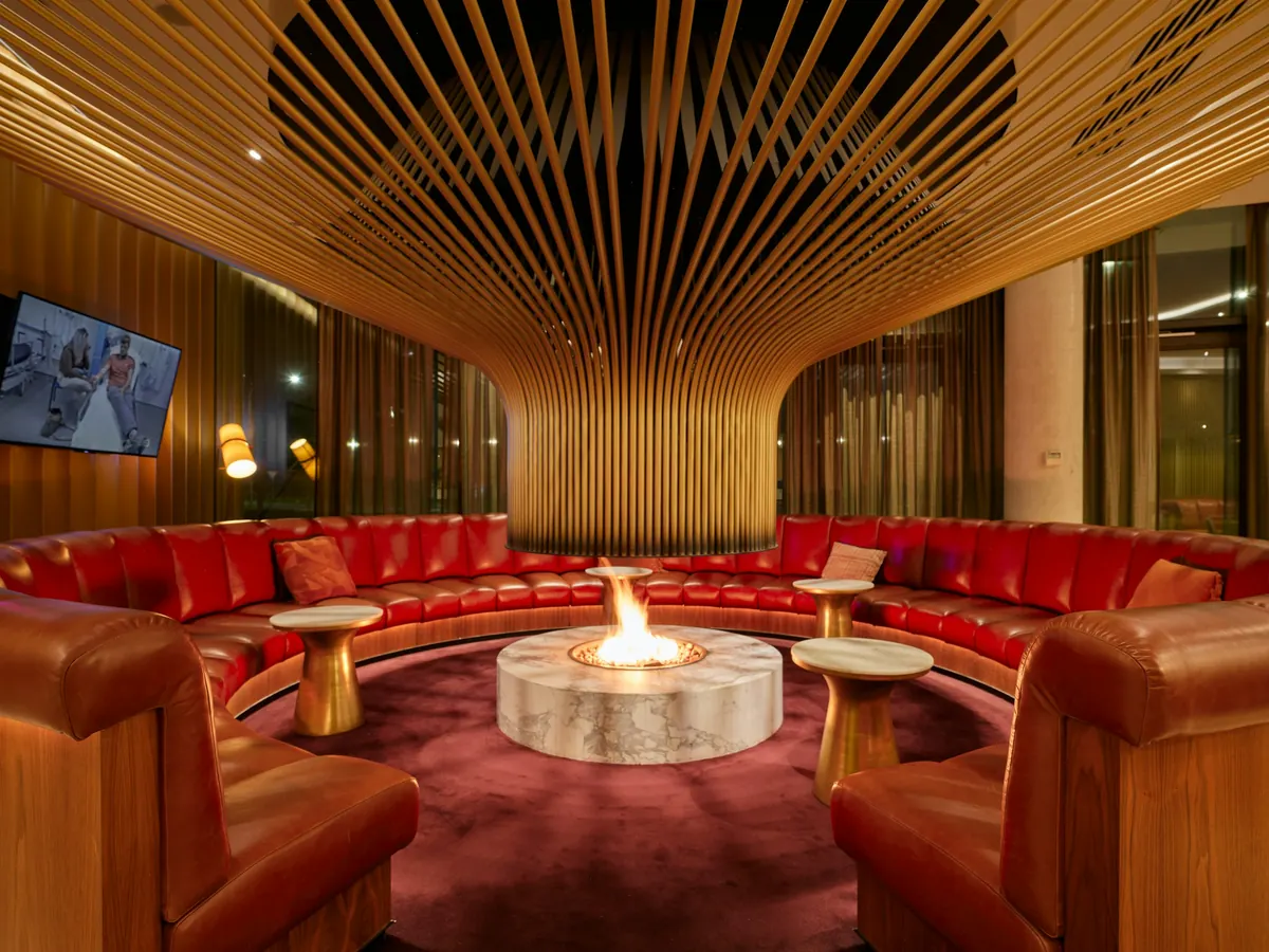 Lounge with a fireplace and red sofas